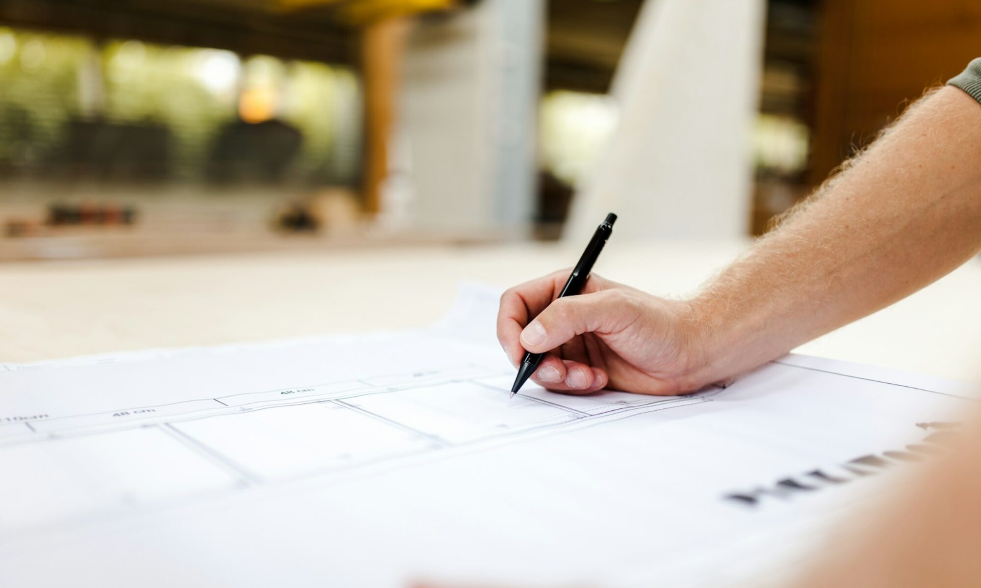 person writing on white paper